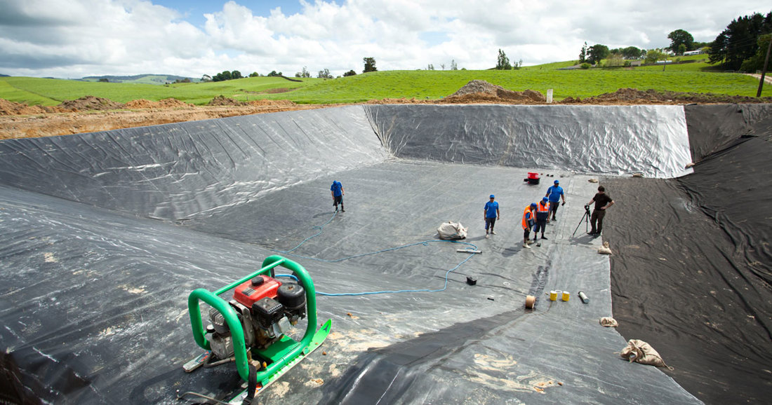 An image of people working on Effluent Pond