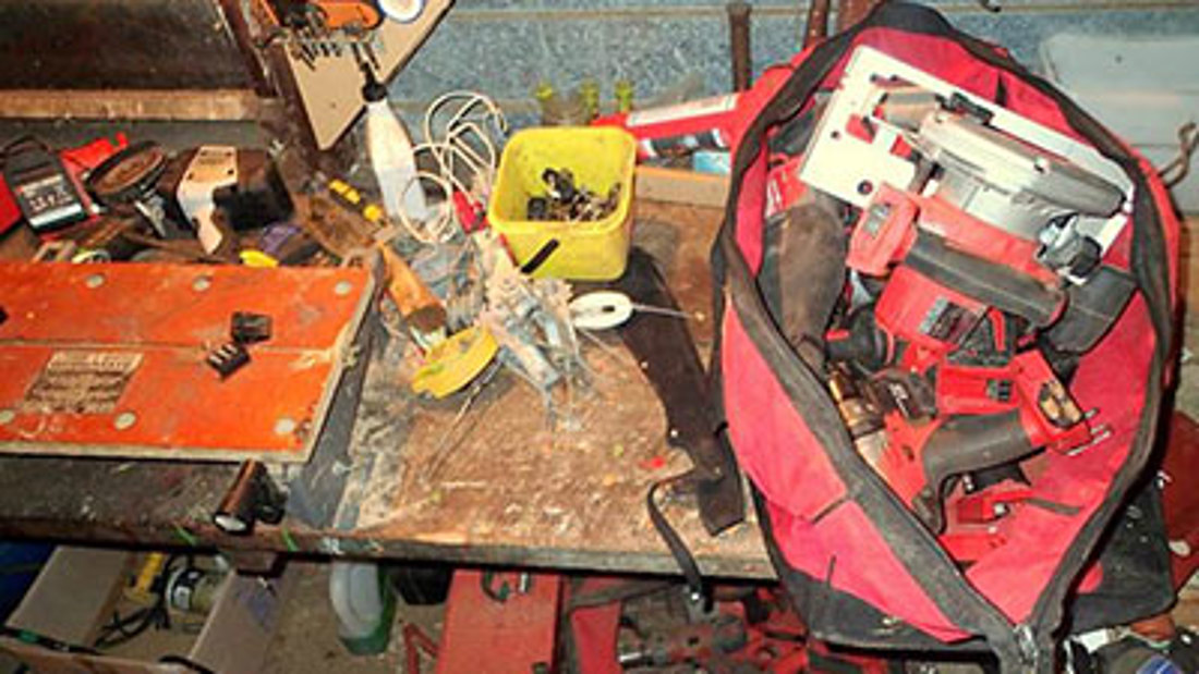 A farm tool workbench before being organised using the Workplace Efficiency Booster
