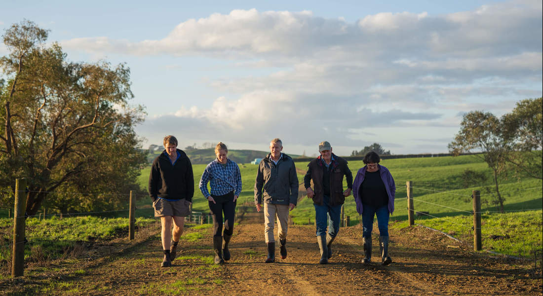 Group Of People Walking Down Track