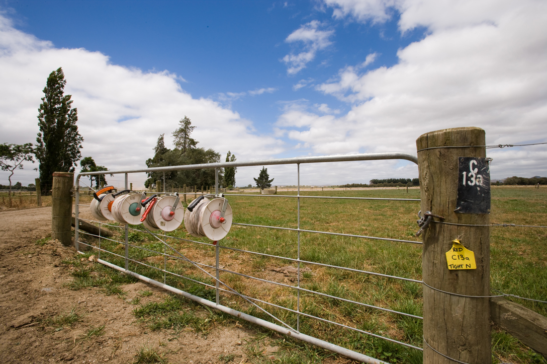 Water reels in farm hanging in a fence