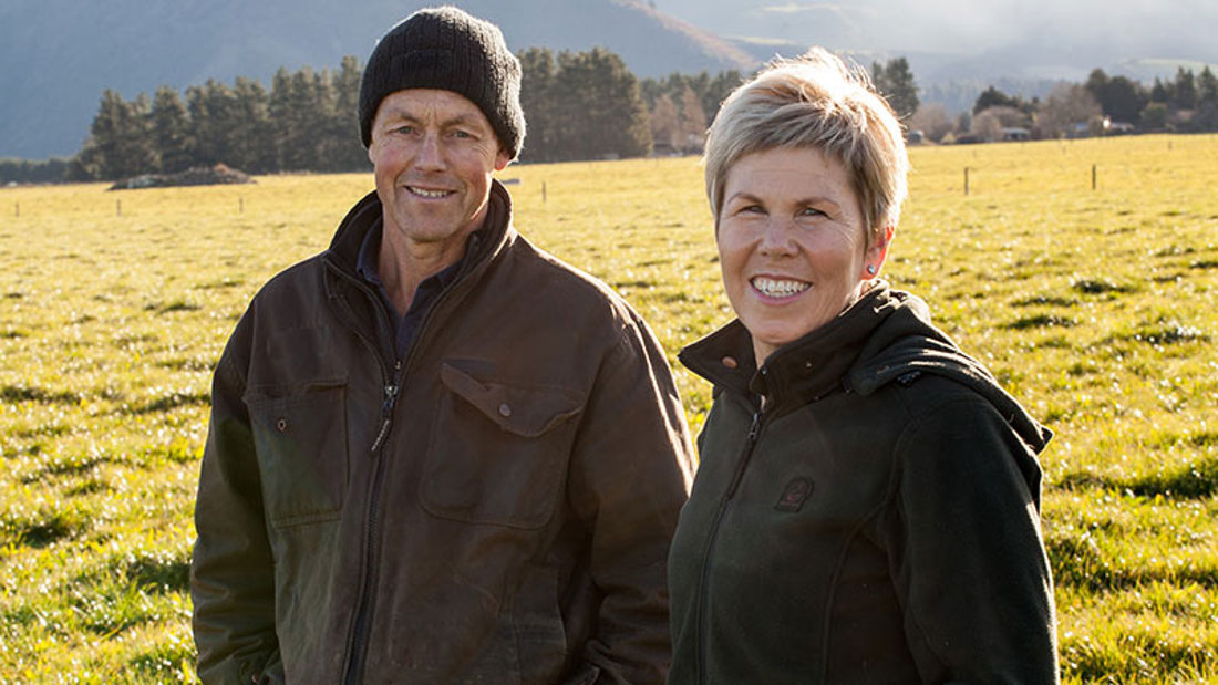 Man and Woman standing in a field